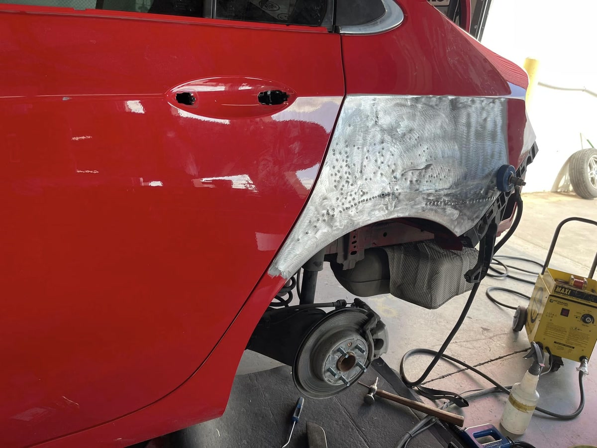 Collision repair work underway in the Superior Collision body shop in Brownsville, TX