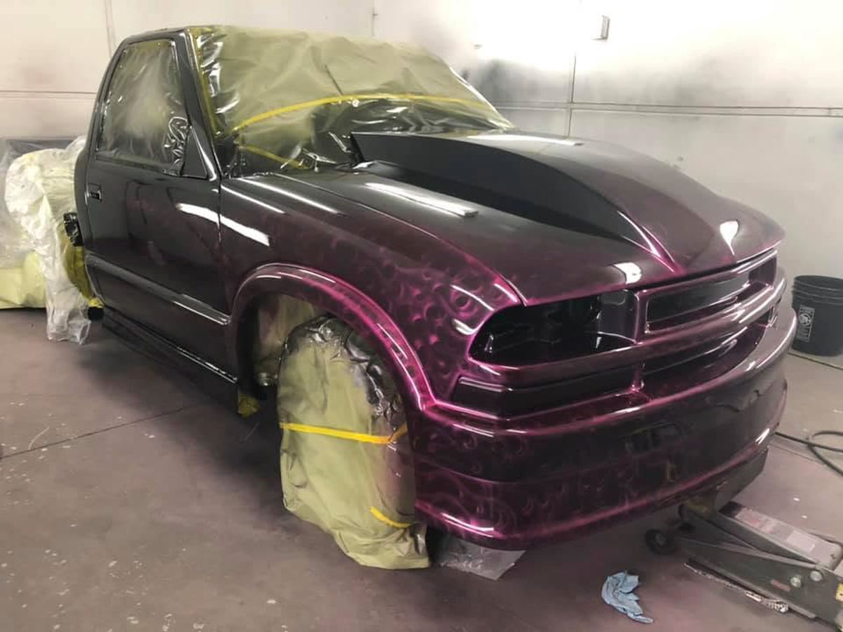 A custom candy-finish paint job on a truck in the booth at Superior Collision, serving Harlingen, TX