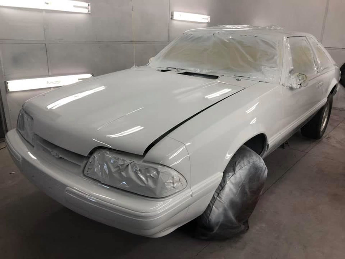 A car in primer sealer in the paint booth at Superior Collision, serving Los Fresnos, TX