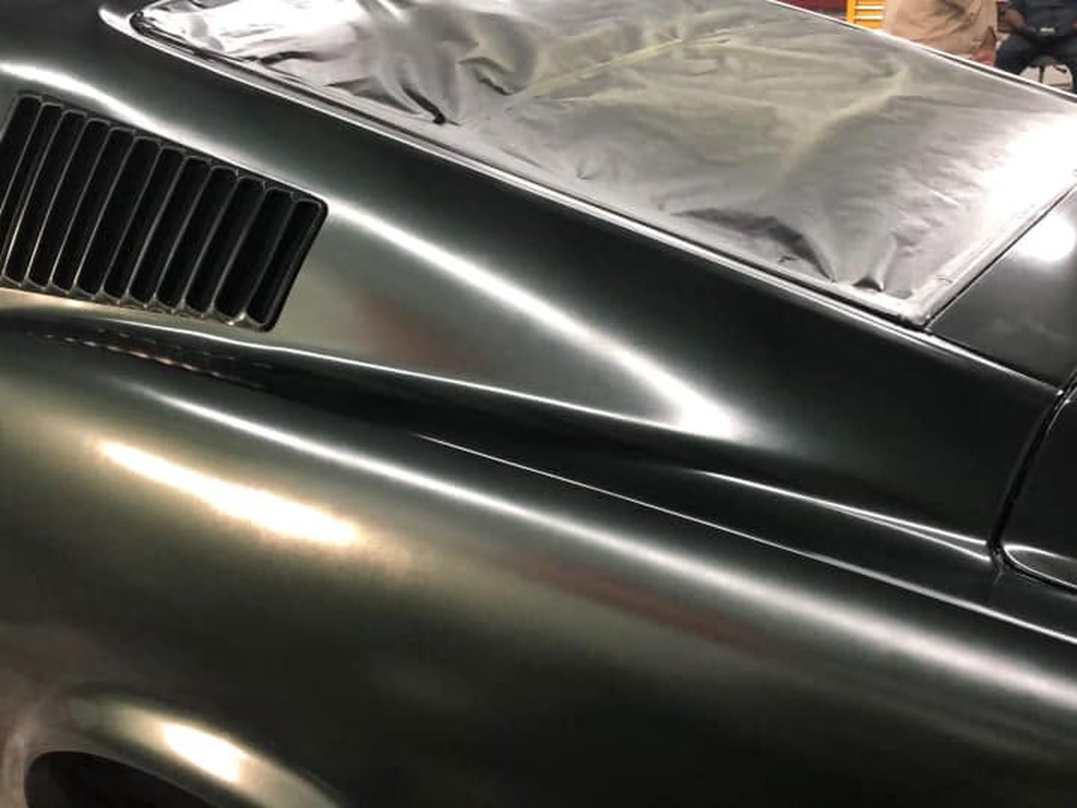 Close-up of a straight, dent-free body line on a repaired panel at Superior Collision in Brownsville, TX